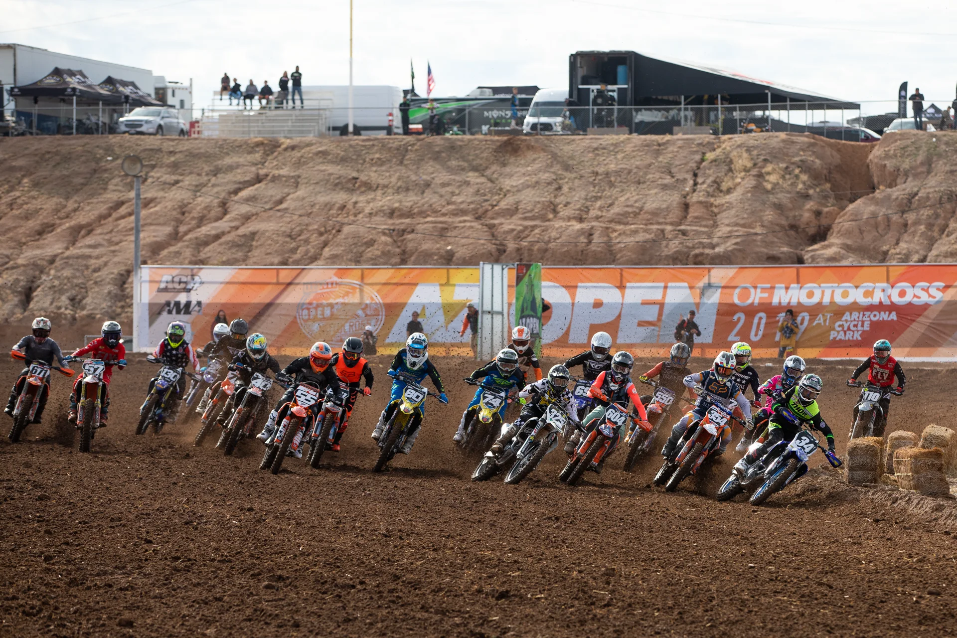 AZ Open motocross riders charging through the first turn